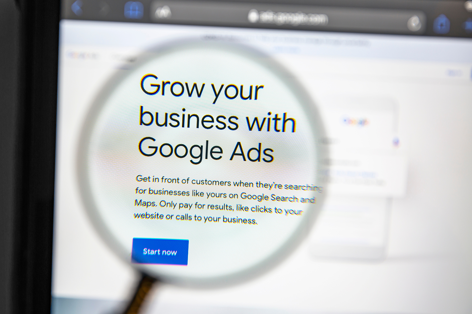 UK SEO agency - Google Ads website under a magnifying glass