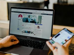 digital marketing agency - man using laptop and mobile