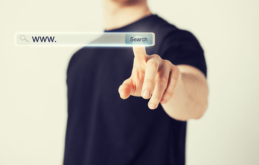 digital marketing - male hand pressing Search button